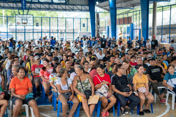 Residents learn all about the Tzu Chi Foundation in a short program before the distribution. 