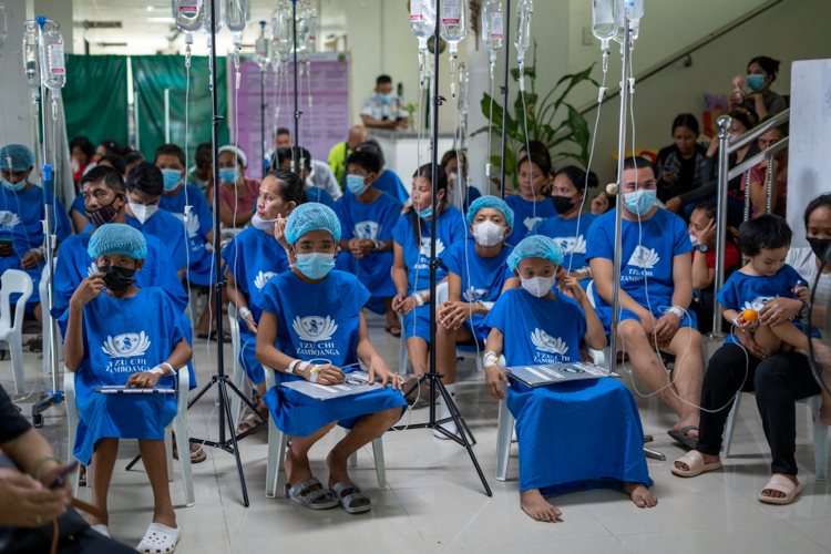 Prepped for their respective surgeries, patients of Tzu Chi’s medical mission wait for their turn inside the Leyte Provincial Hospital in Palo, Leyte.