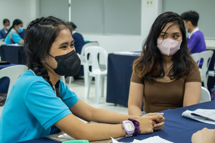 In her second reapplication interview, Michelle Jose (left), a 21-year-old Bachelor in Early Childhood Education incoming senior from the Philippine Normal University, is accompanied by her sister Marijoe (right). 【Photo by Marella Saldonido】