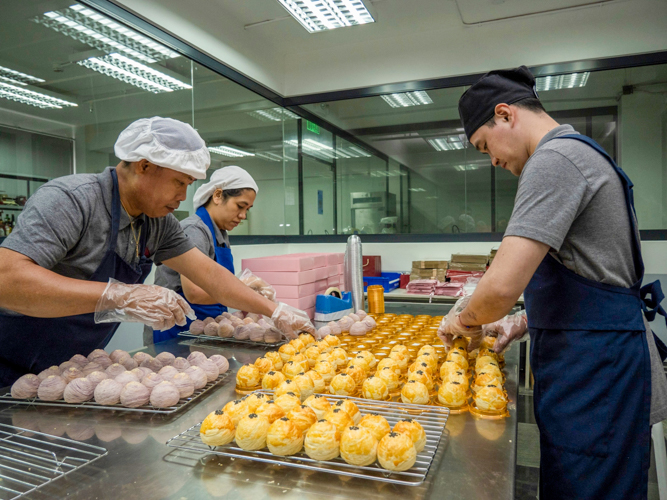 At Tzu Chi's bakery, staffers prepare pastries and other baked goods to sell.