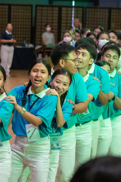 The perfect way to end the three-day camp: with scholars singing and dancing around the Jing Si Auditorium.