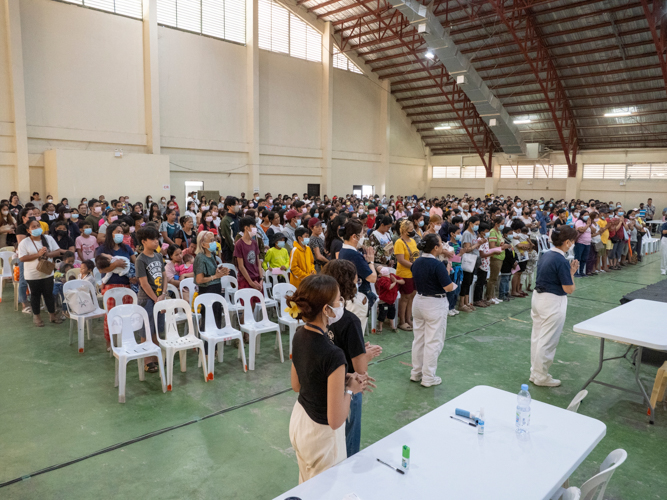 Everyone participates in the opening prayer at the medical mission in Palo, Leyte.