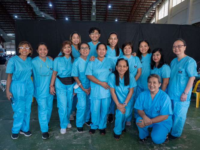 Volunteer dentists pose together for a photo at the medical mission.