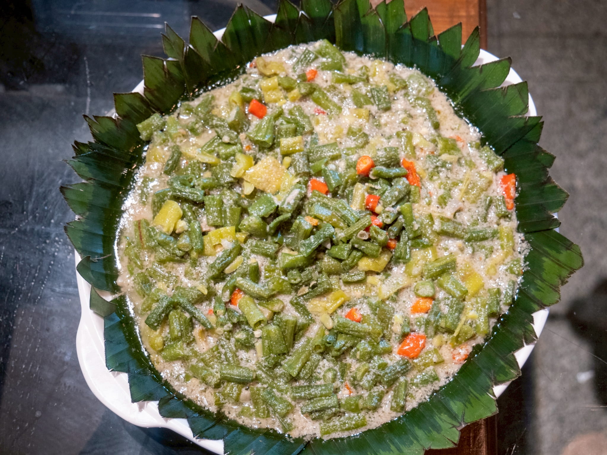 Tzu Chi’s Bicol express uses TVP, string beans, and taro leaves simmered in luxurious coconut milk and generous servings of garlic and chili peppers. 