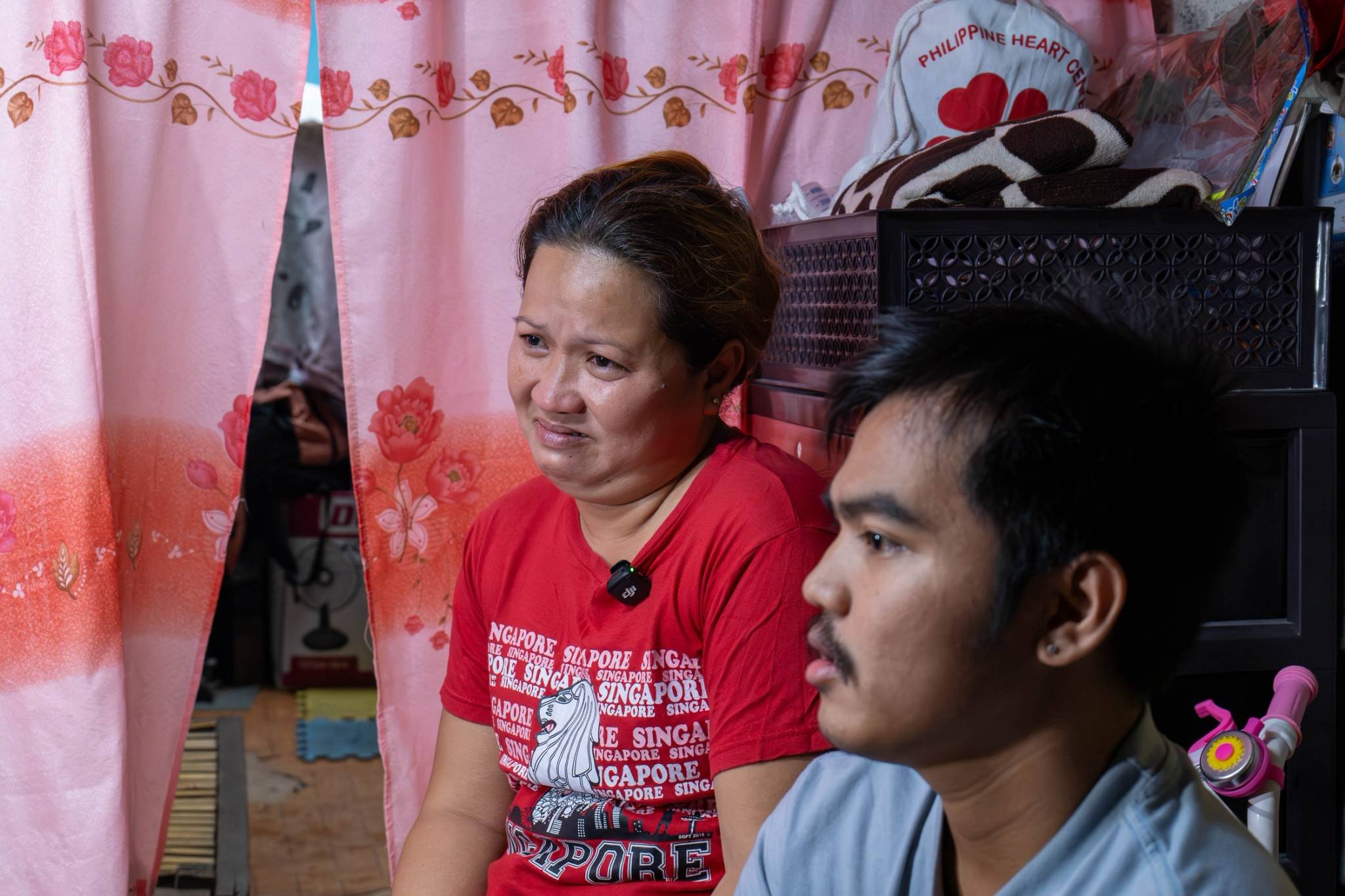 Rizalina Sacdalan (left), a single mother who raised her two children on her own while working overseas as a domestic helper, grows emotional as she expresses her joy over her son’s successful operation and her hope for a brighter future ahead. 