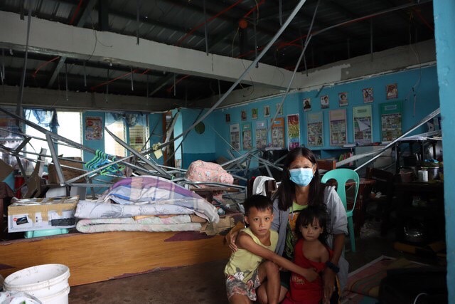 Ibo Elementary School in Lapu-Lapu City, Cebu, serves as a temporary home for 55-year-old Marietta Sembrano, her daughter, son, daughter-in-law, and grandchildren. But the shelter itself is not safe as its ceiling frame of the classroom they’re staying in collapsed. 