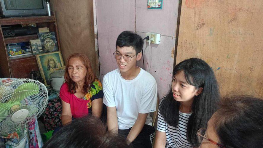 With their mother (first from left) at home, John Welter Manayaga and Jean Myca Manayaga are typical twins. “We’re close,” says John Welter, born three minutes after his sister. “Whenever she has a problem, I motivate her, give her advice, make her feel better.” “And I like to pester him and tell him everything. We understand each other,” says Jean Myca.