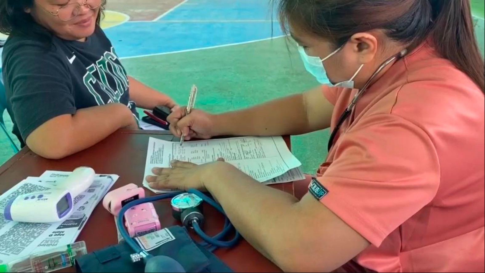 Venus Telecio (right) now serves as a nursing aide at Malabon Hospital and Medical Center, turning the opportunity she received through Tzu Chi's caregiving scholarship into compassionate service for others