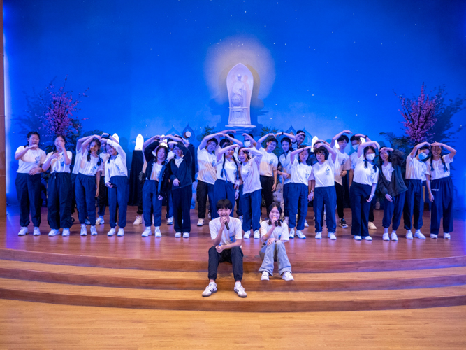 Tzu Chi Youth camp groups take turns performing on stage for Gratitude Night. 