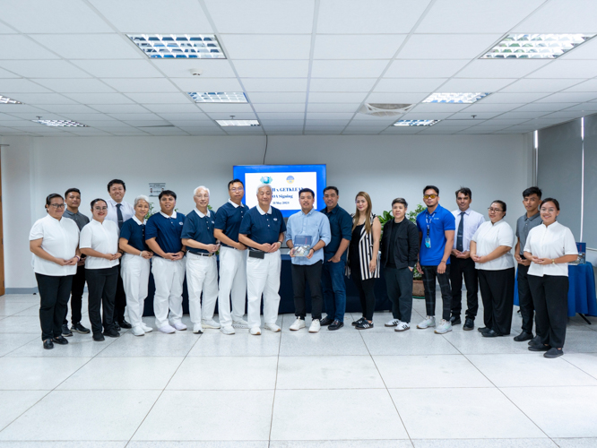 Tzu Chi volunteers and Tech-Voc staff pose for a group photo with GetKlean Philippines executives and officers.