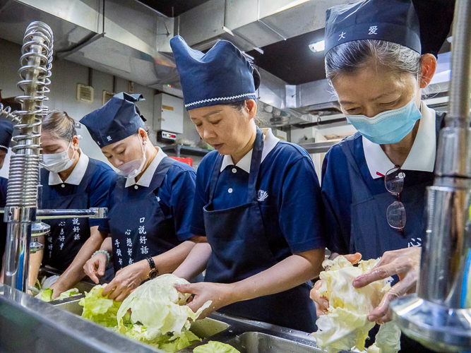 Tzu Chi’s kitchen is one of the busiest areas for major events like May 12’s 3-in-1 event. Here, volunteers prepare ingredients for a vegetarian menu. 