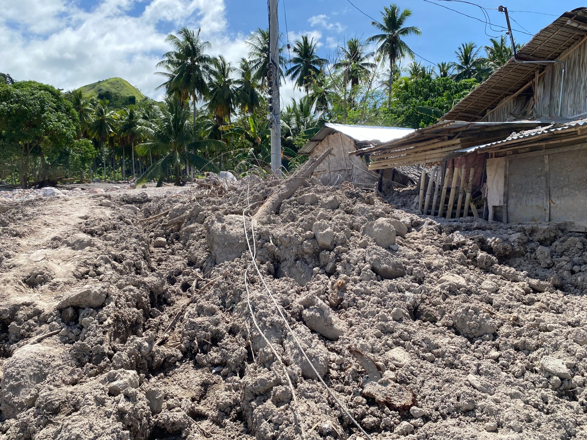 Houses were wiped out by mud and boulders in a community beside a mountain in Brgy. Kusiong, Datu Odin Sinsuat, Maguindanao del Norte. 【Photo by Harold Alzaga】
